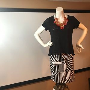 Women’s clothing lwith necklace black and white.